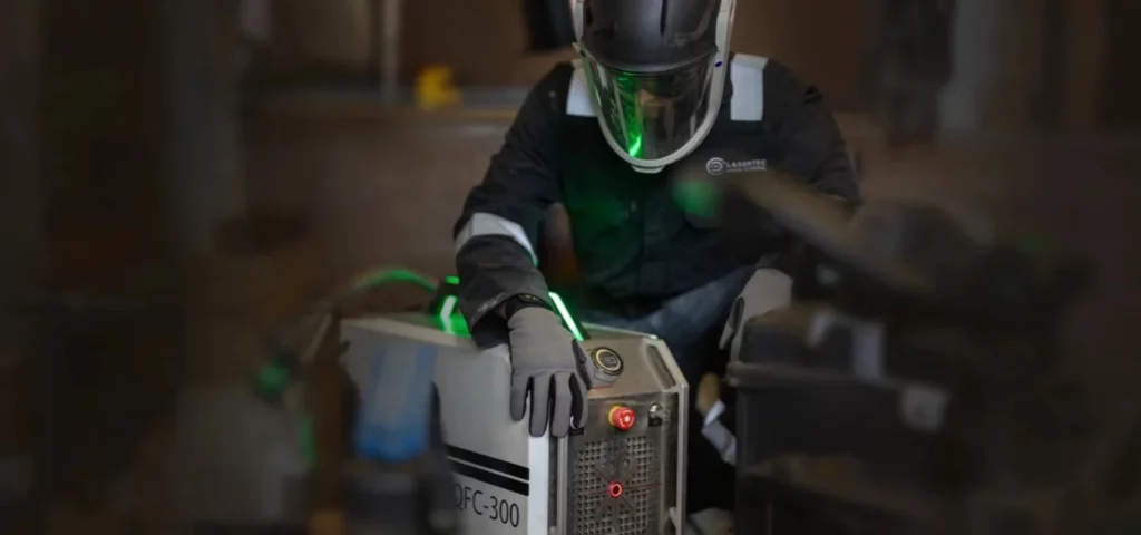 Lasertec employee working with a laser cleaner
