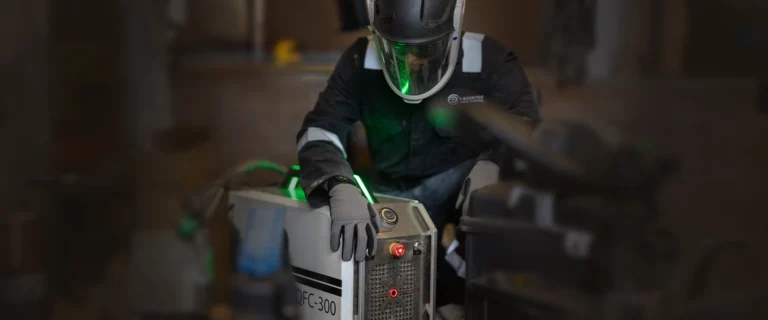 Lasertec employee working with a laser cleaner