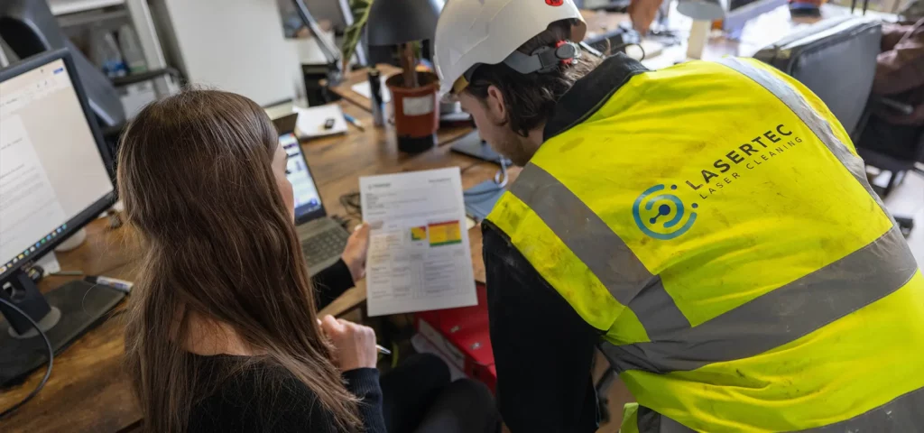 Lasertec site supervisor reviewing project documentation on a UK construction project