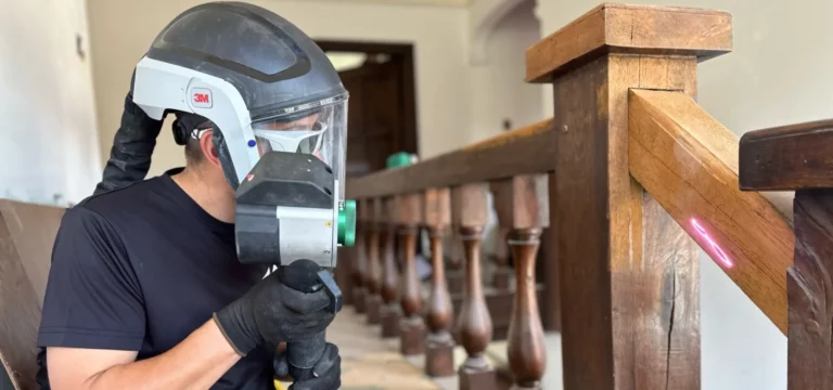 Laser cleaning removing varnish from a wooden surface