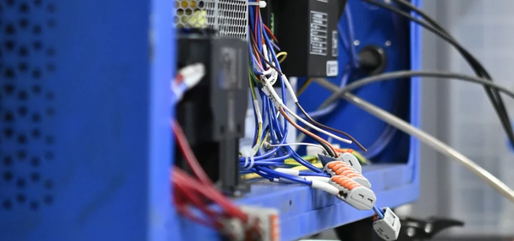 Internal wiring loom and terminal connectors inside the cabinet of a laser cleaning machine